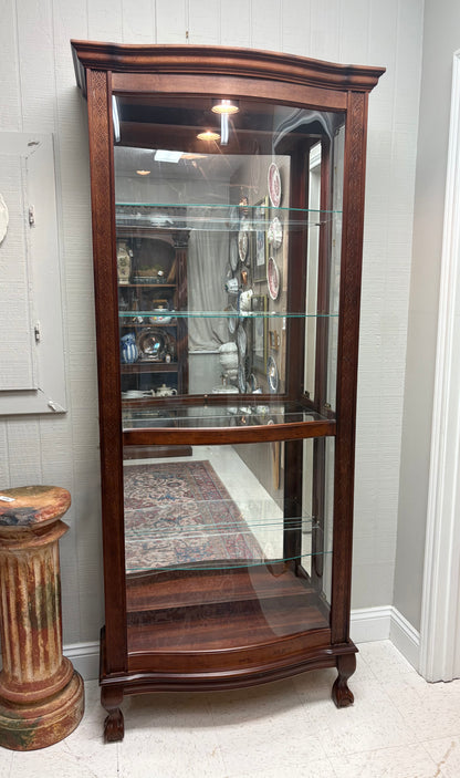 Footed Cherry Curio with Bowed Front & Carved Detail
